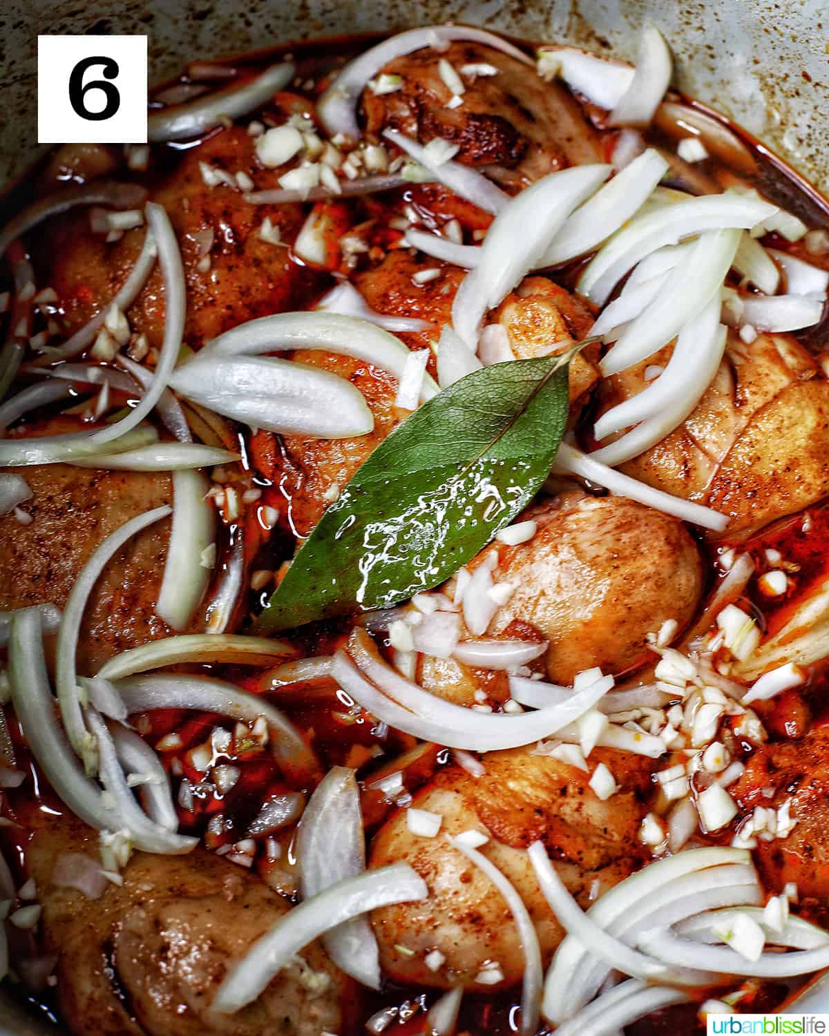 bay leaves, garlic, onions, soy sauce, sugar added to chicken adobo in the Instant Pot.