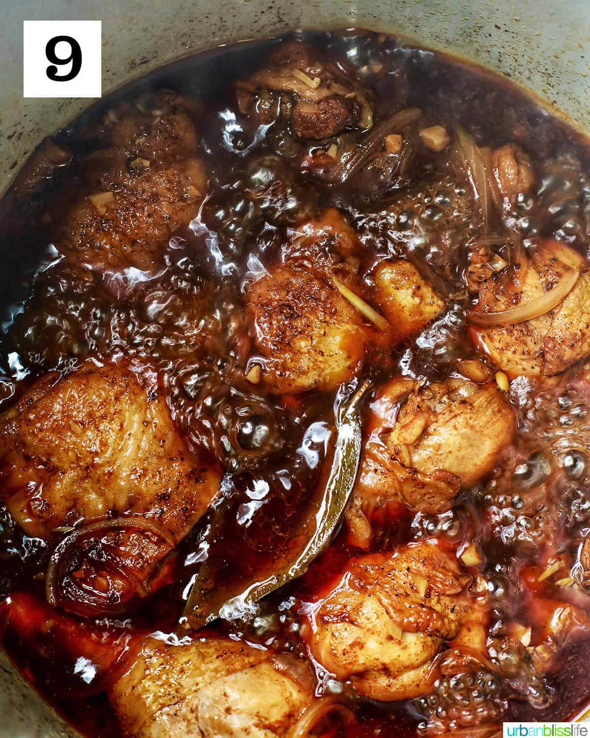 adobo chicken boiling in an Instant Pot to create a thicker adobo glaze.