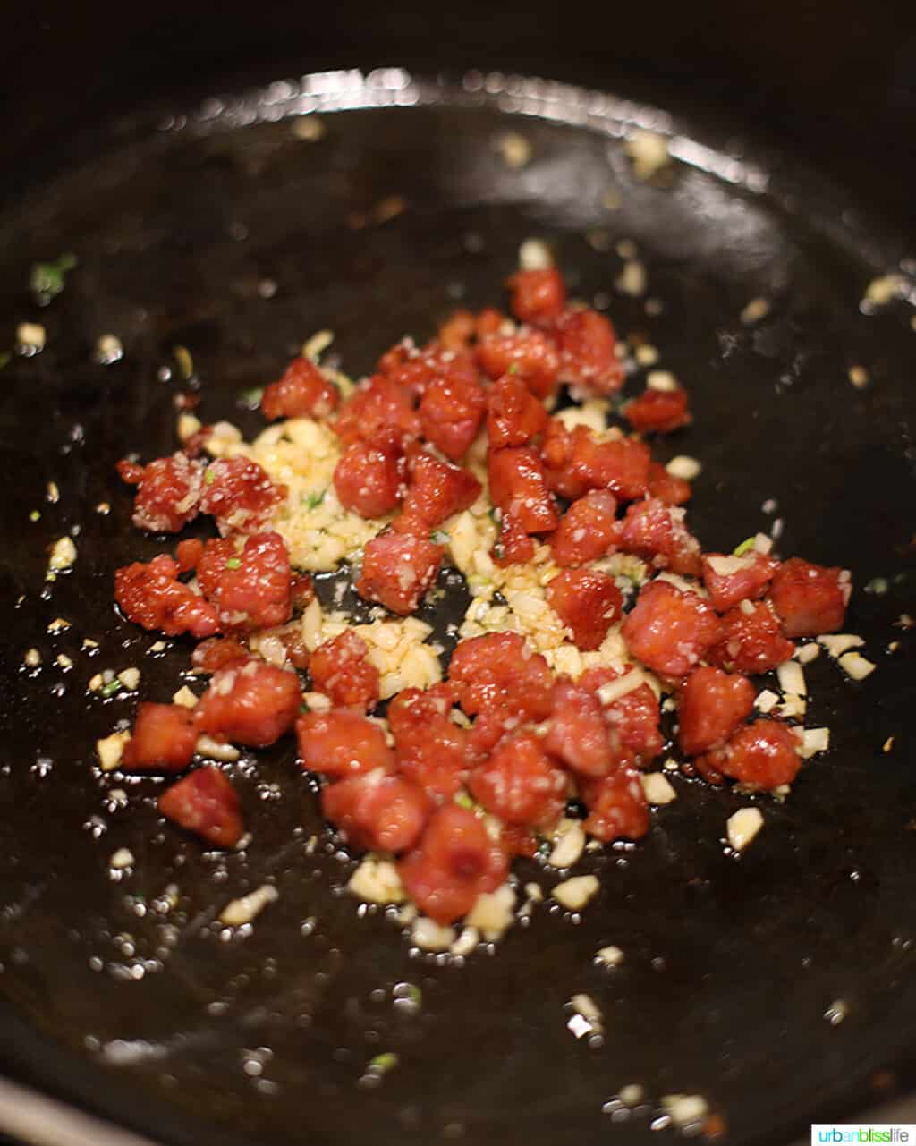 longganisa sauteing in skillet