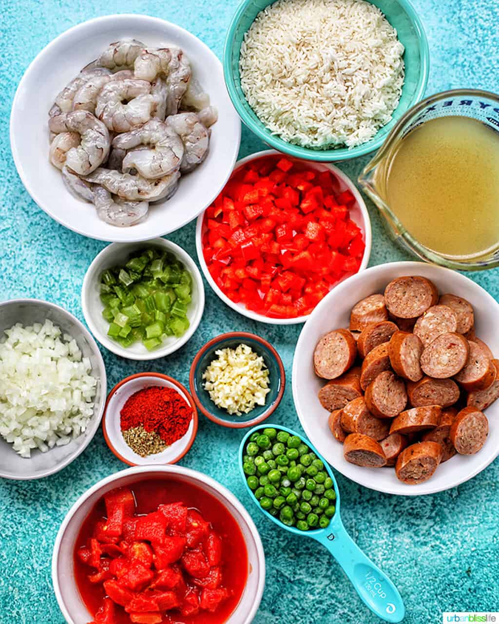 bowls of ingredients for seafood jambalaya