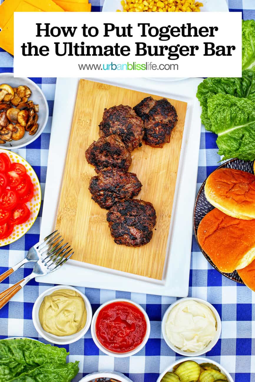 the ultimate burger bar with all the fixings on checkered tablecloth with text overlay