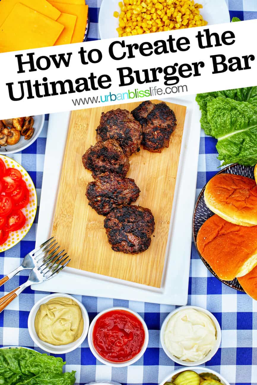 the ultimate burger bar with all the fixings on checkered tablecloth with text overlay
