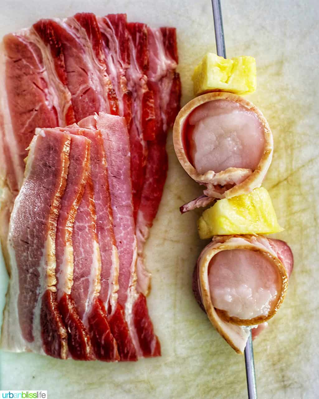 assembling bacon-wrapped scallop skewers