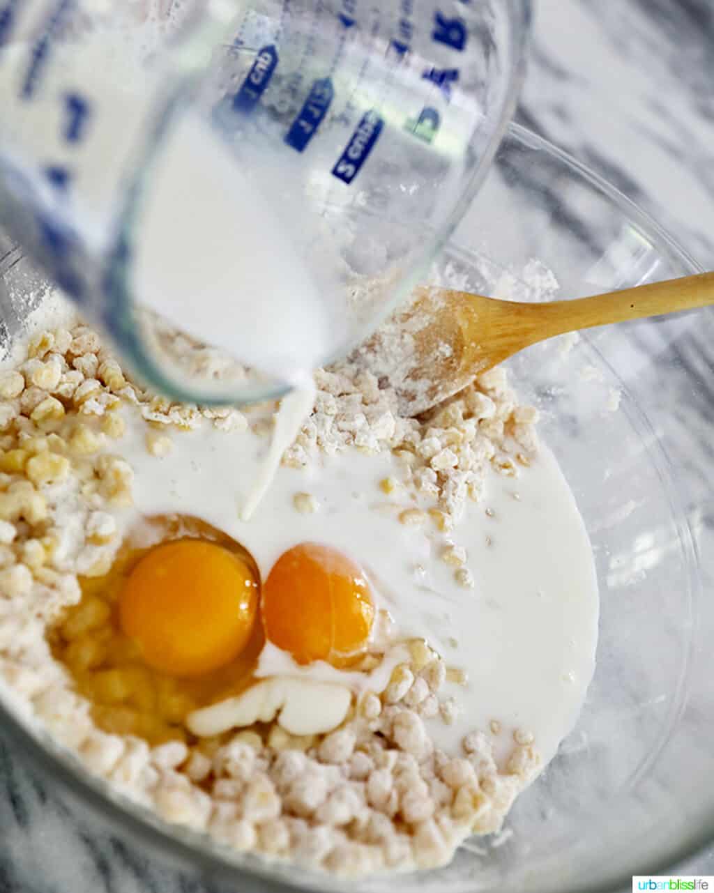 adding milk to batter