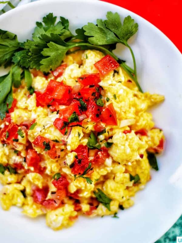 eggs with salsa in a white bowl