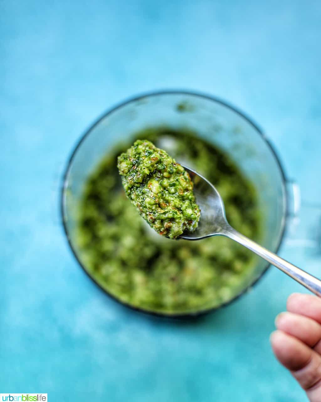 almond basil pesto on spoon