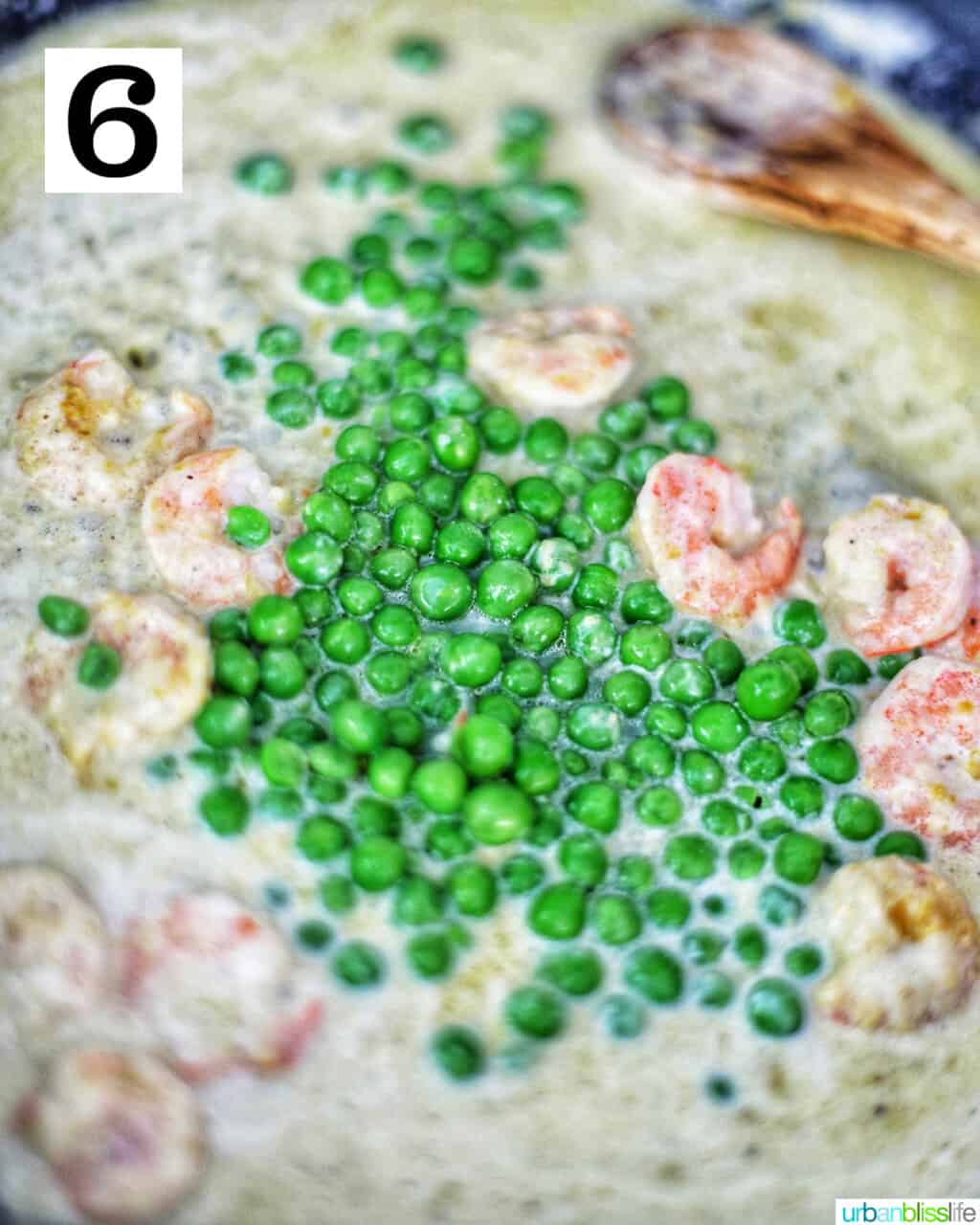 adding peas to the pan