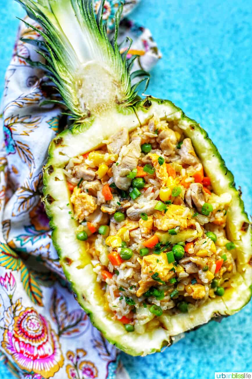 chicken pineapple fried rice in hollowed out pineapple boat
