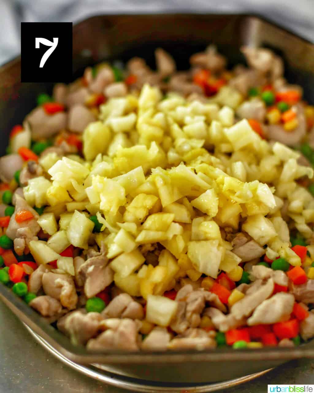 pineapple mixing into fried rice