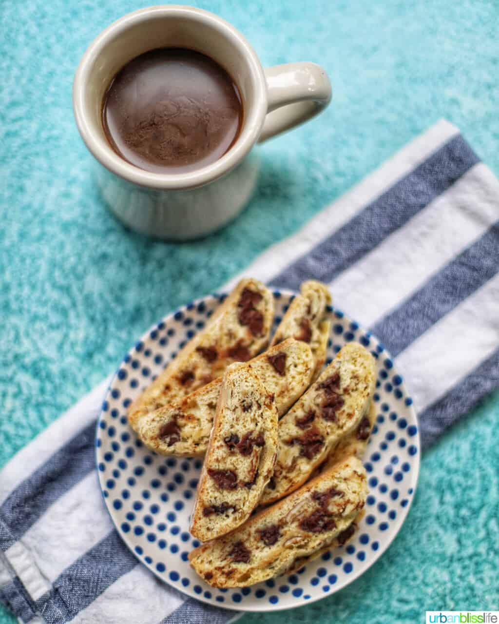 cup of coffee with chocolate chip almond biscotti
