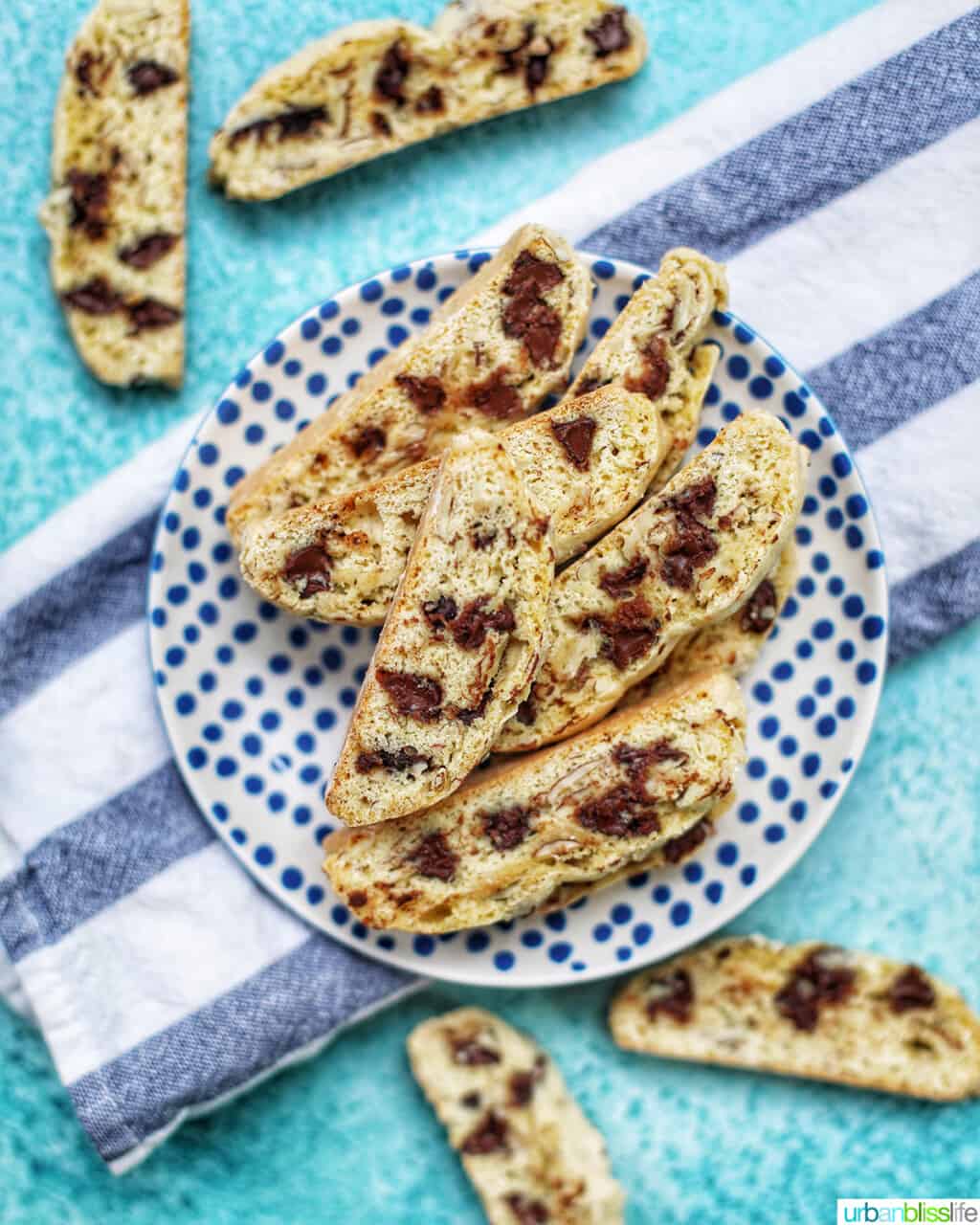 chocolate chip almond biscotti on a plate and towel