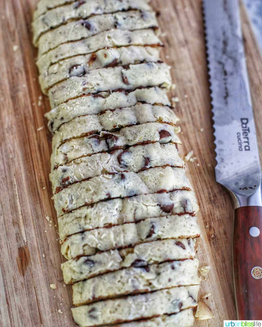 slicing chocolate chip almond biscotti