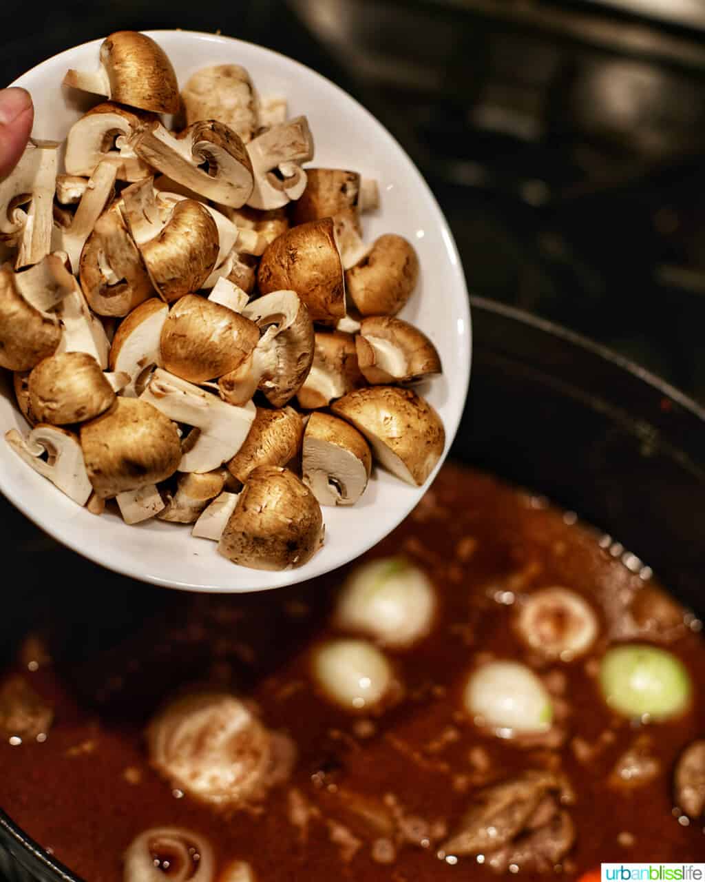 adding mushrooms to dutch oven