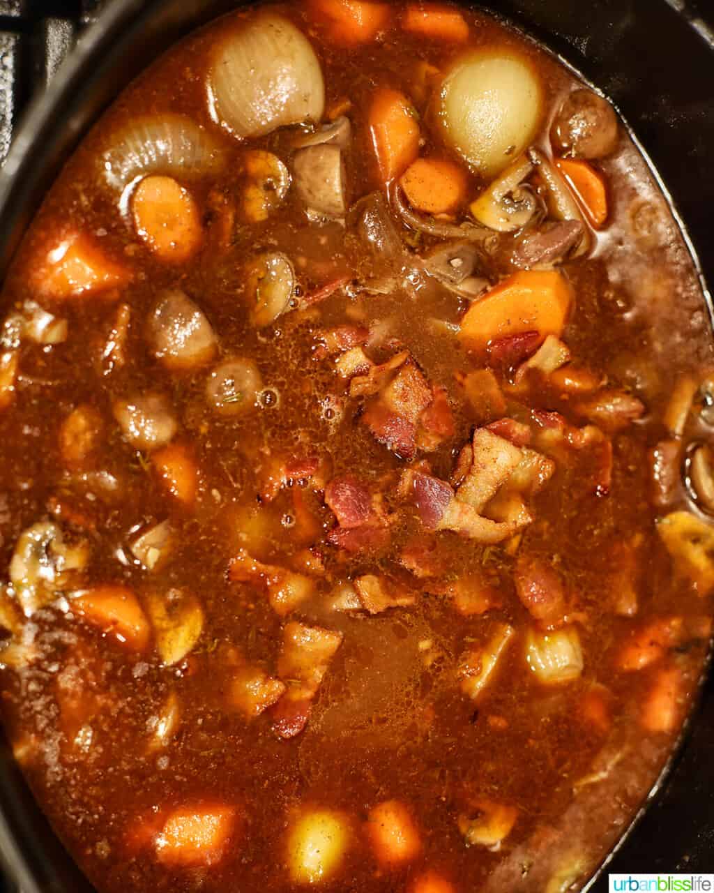 beef bourguignon cooking in pot