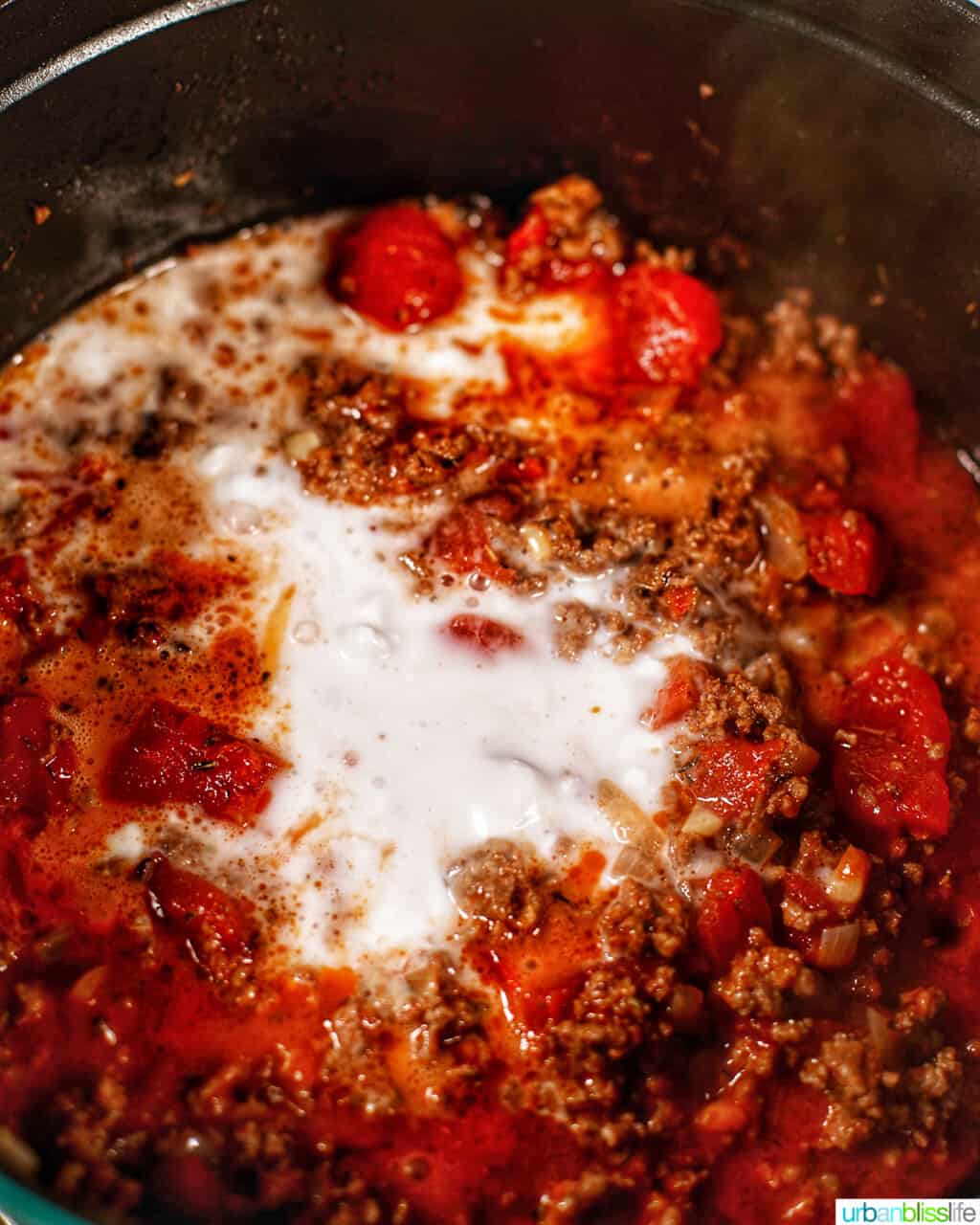 adding coconut cream to pasta