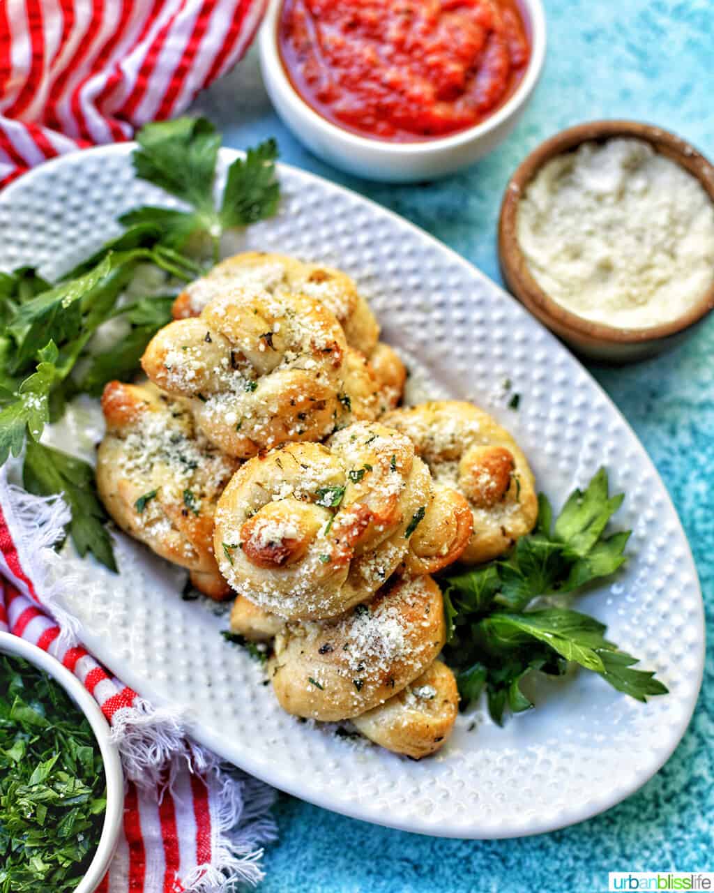 Garlic parmesan knots on platter