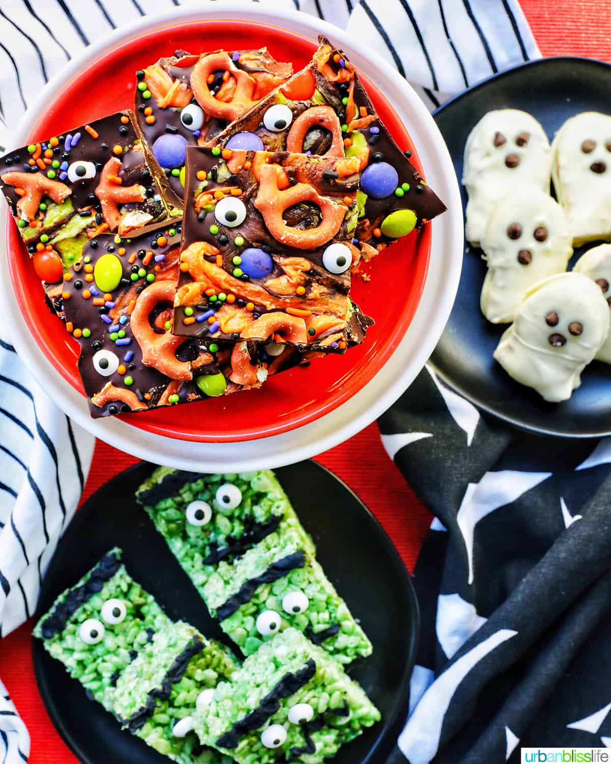 trio of Halloween treats on orange, black, and white plates