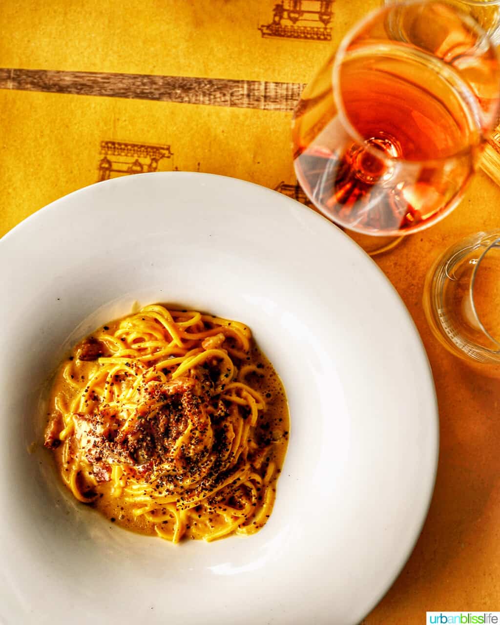 spaghetti carbonara with rosรฉ wine