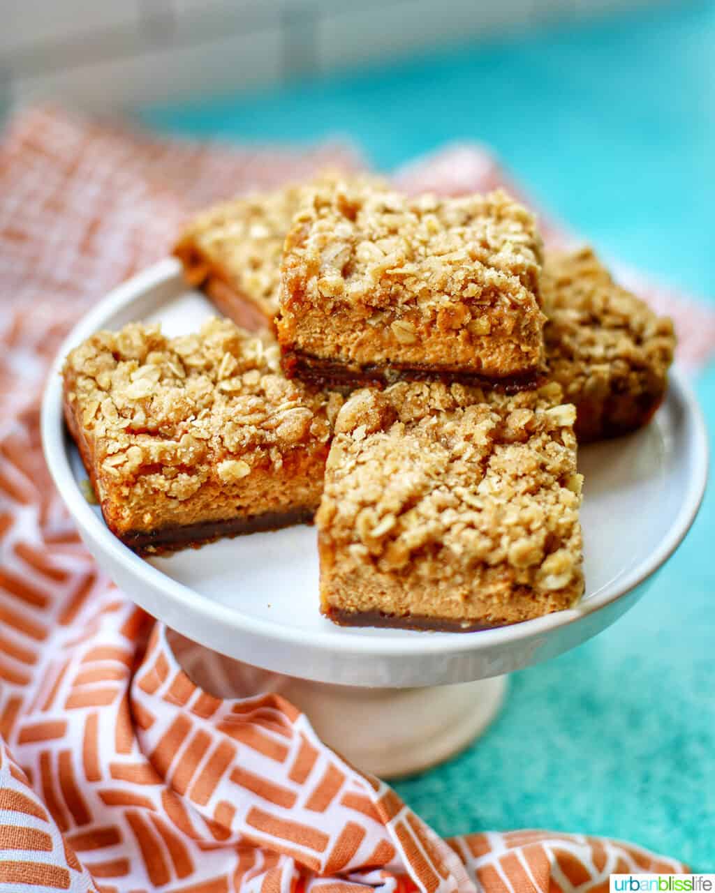 Pumpkin Cheesecake Bars with Gingersnap Crust on plate