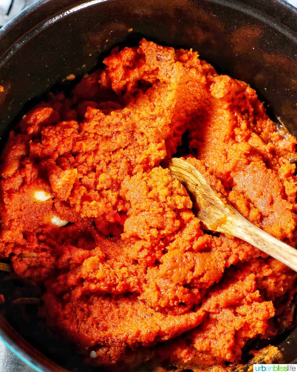 mixing pumpkin puree for vegan pumpkin soup
