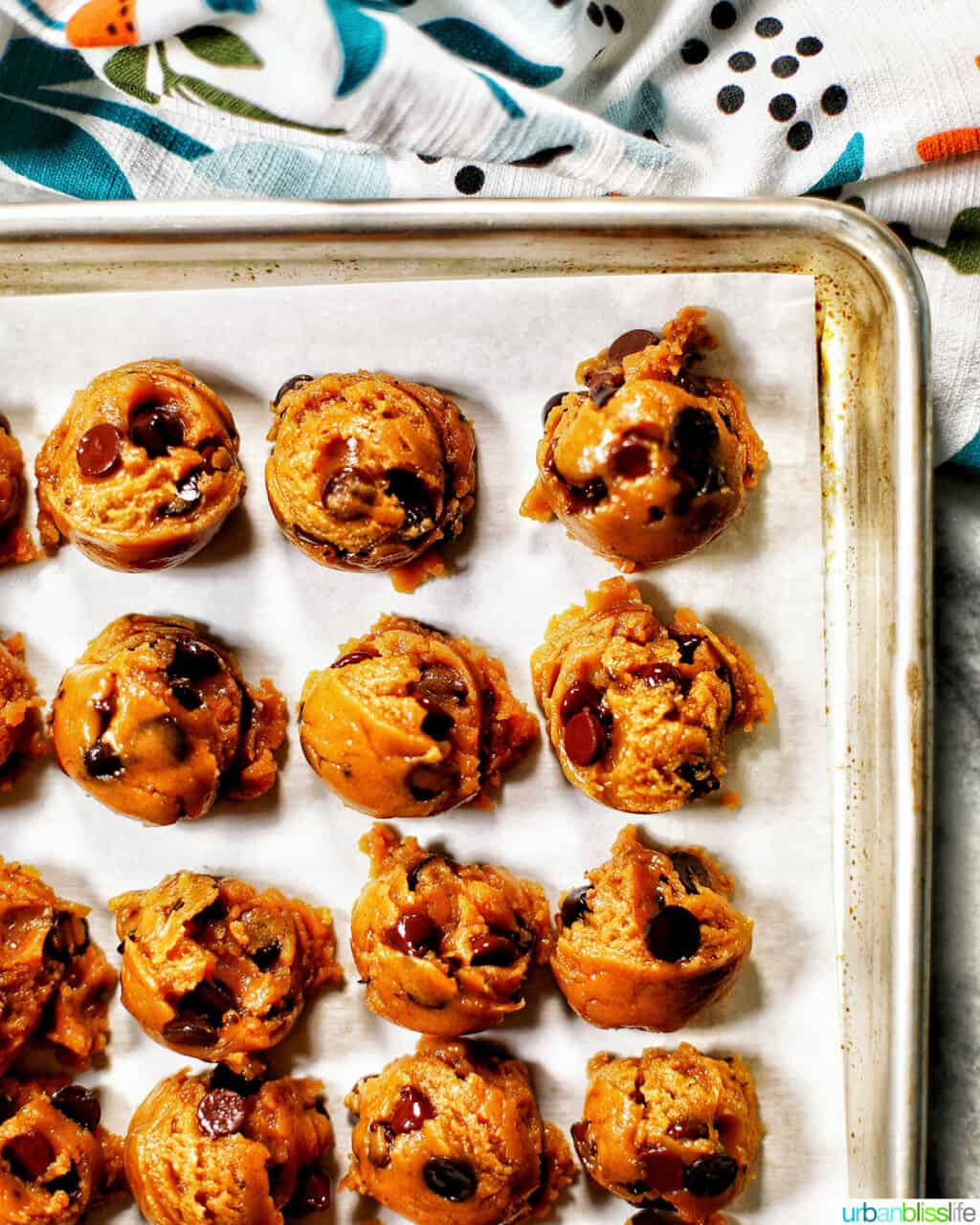 scoops of batter for chocolate chip espresso cookies on baking sheet