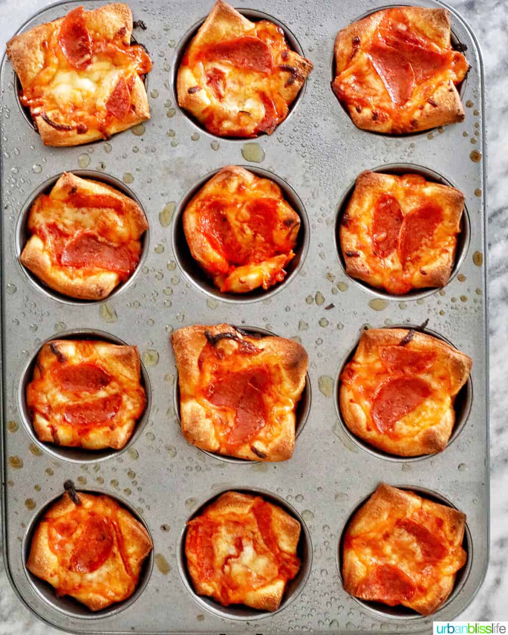 baked pizza cups in muffin tin