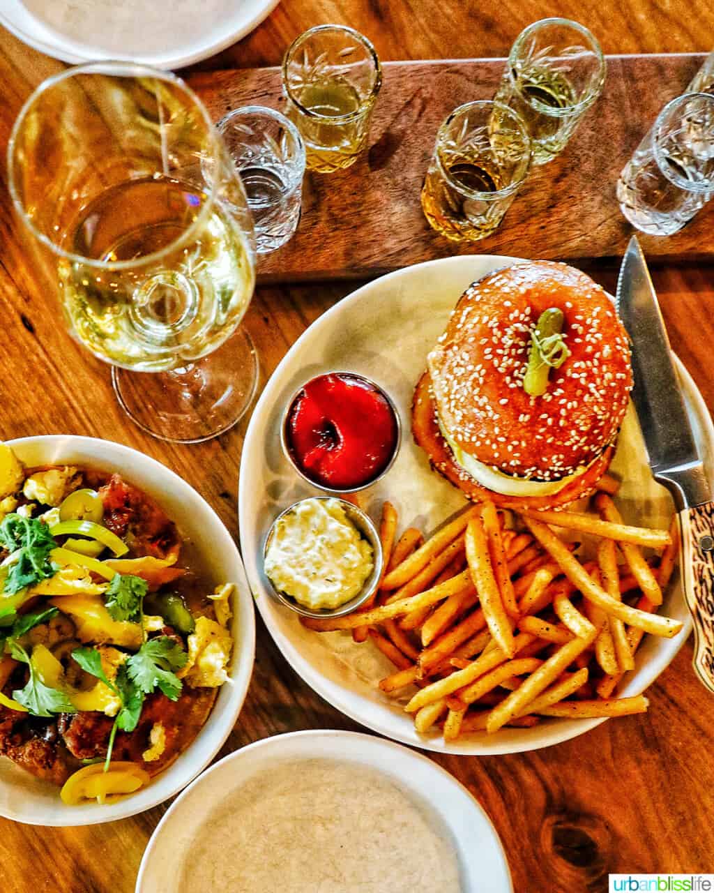 Fried chicken tacos, burger, and glass of wine at Bullard Tavern