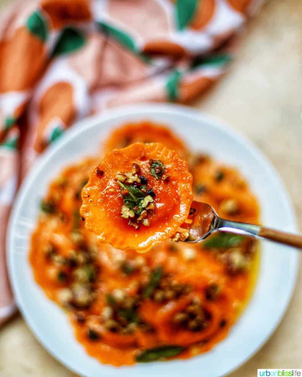 forkful of Butternut Squash Ravioli with Crispy Sage and Brown Butter Sauce