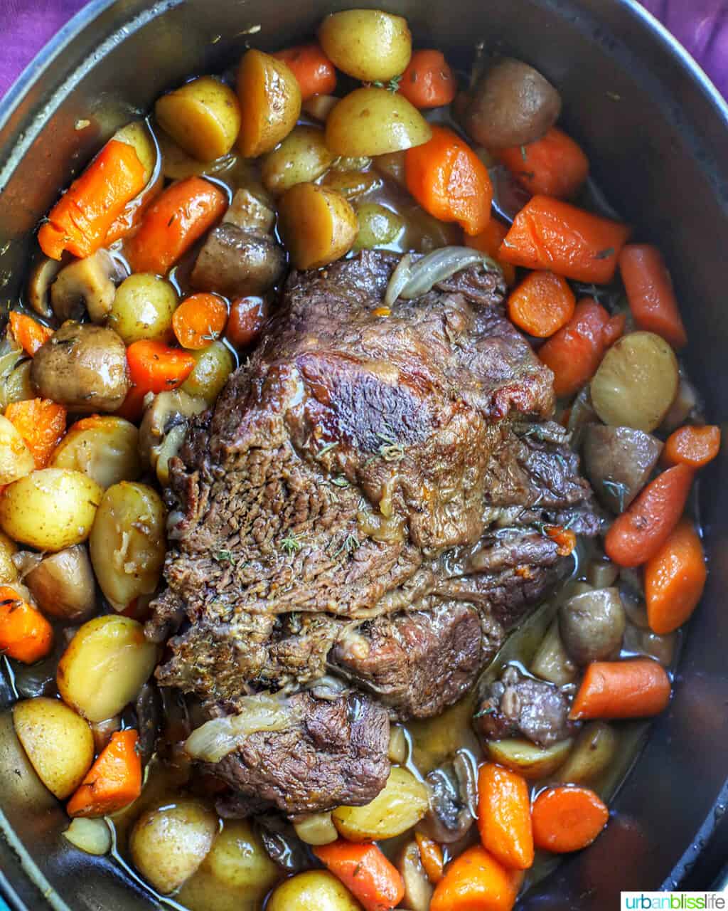 Cooked pot roast with veggies in a dutch oven