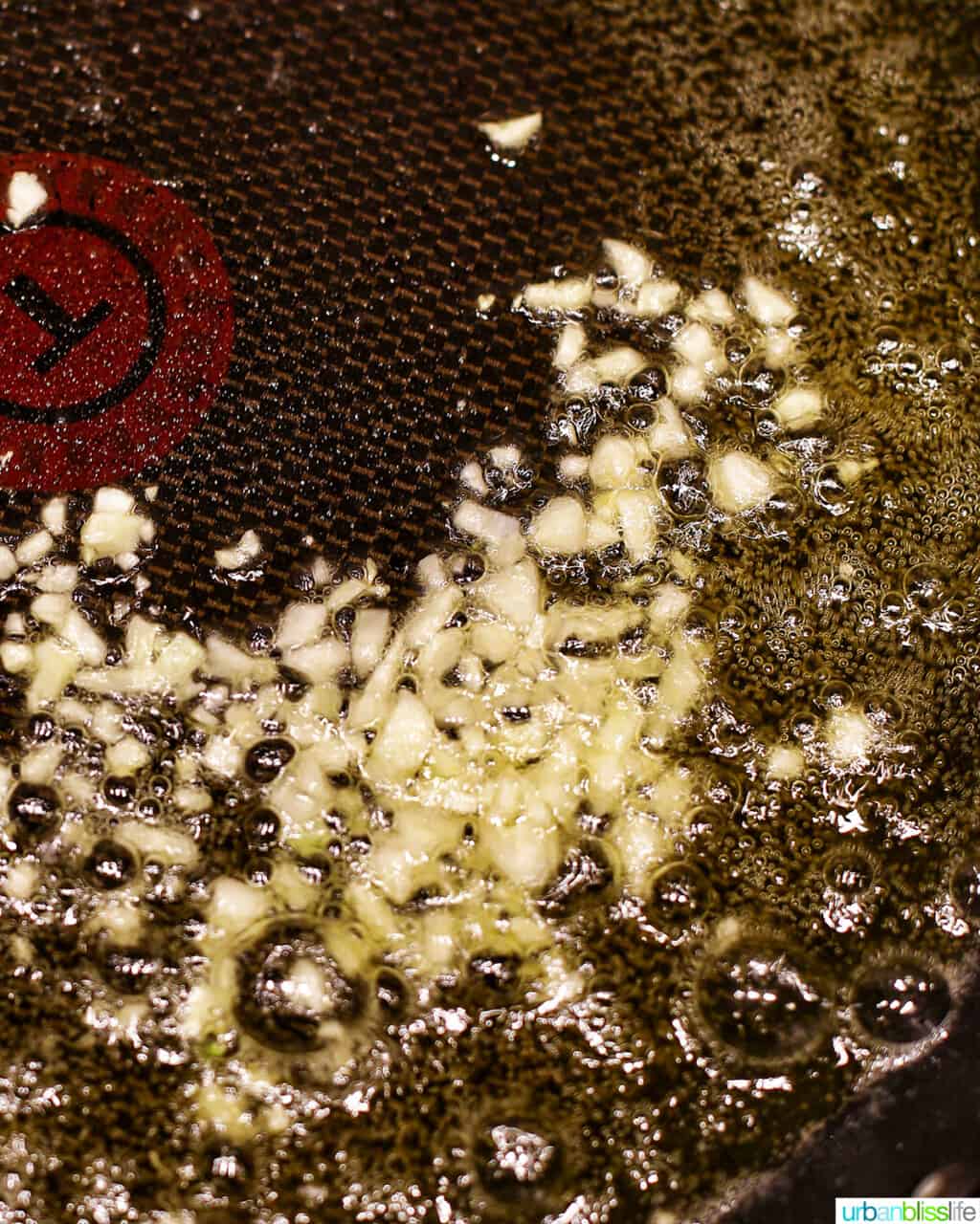 sauteing garlic in a pan