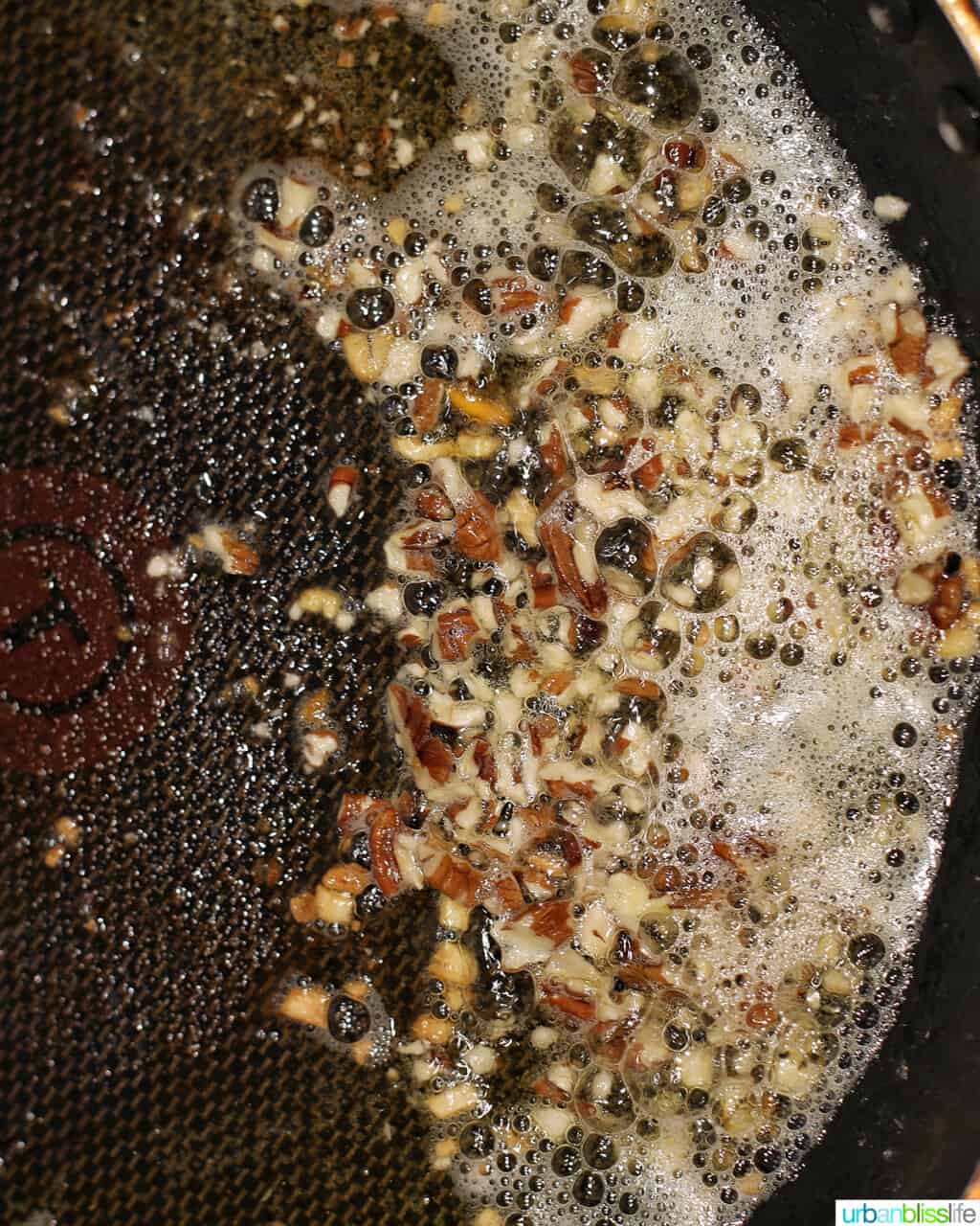 sauteing pecans in a pan
