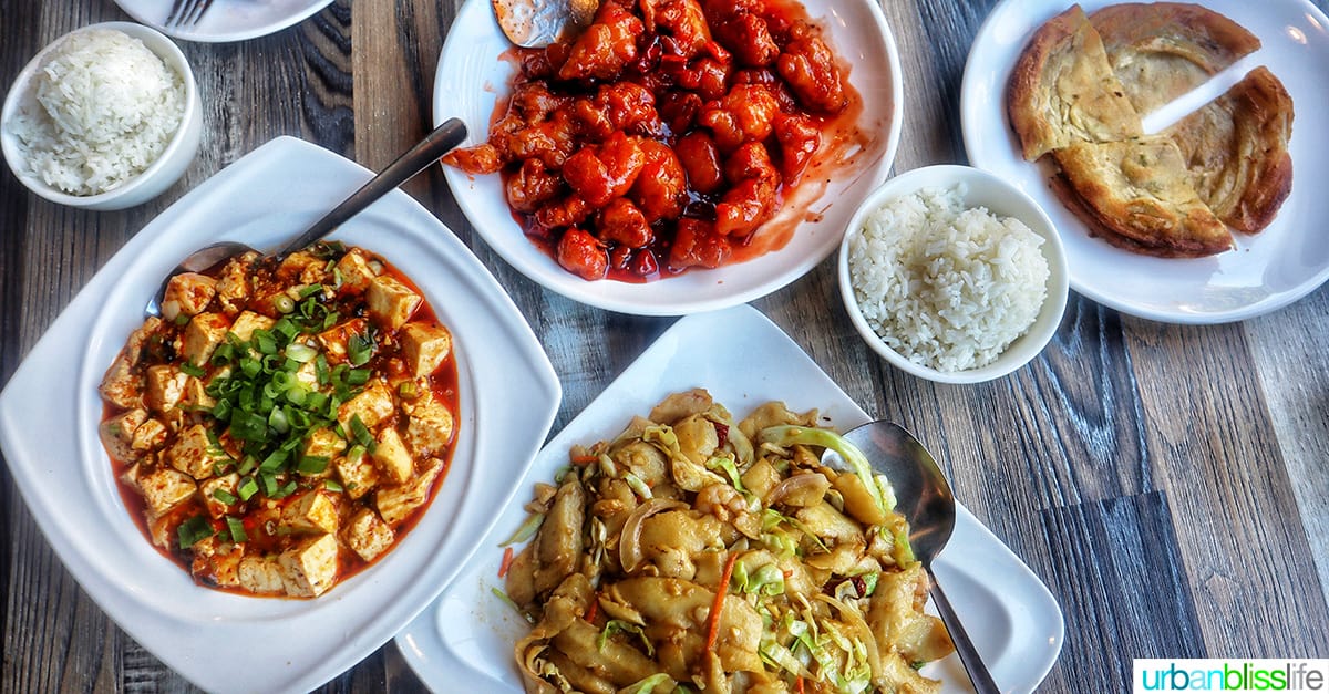 four plates with Chinese food at Tasty Corner restaurant in Portland Oregon.