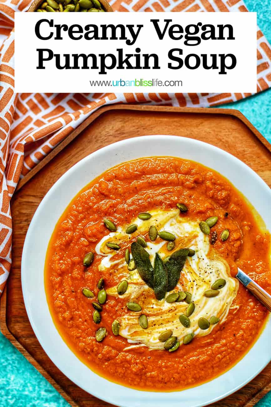 bowl of creamy vegan pumpkin soup with Pinterest text overlay