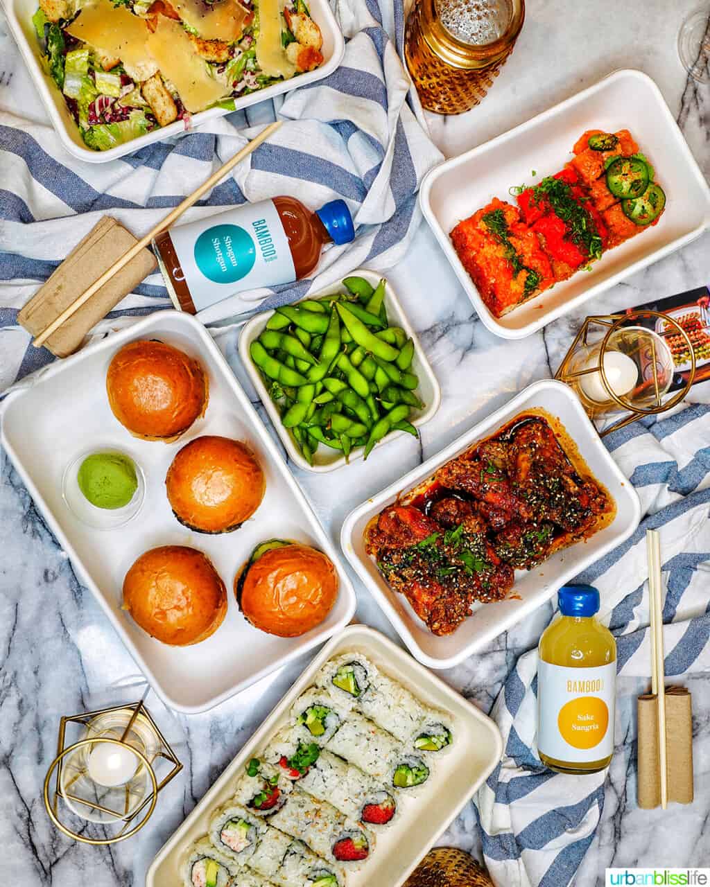 table full of take-out Bamboo Sushi food