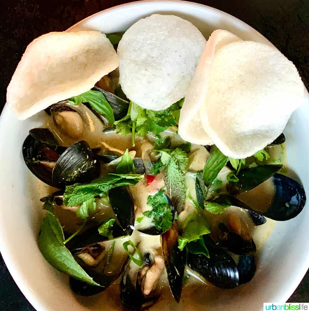 white bowl of mussels at at La Moule restaurant in Portland, Oregon.