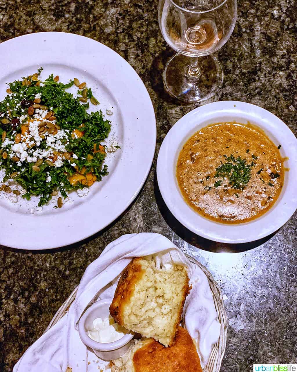 bowls of soup, salad, and bread.