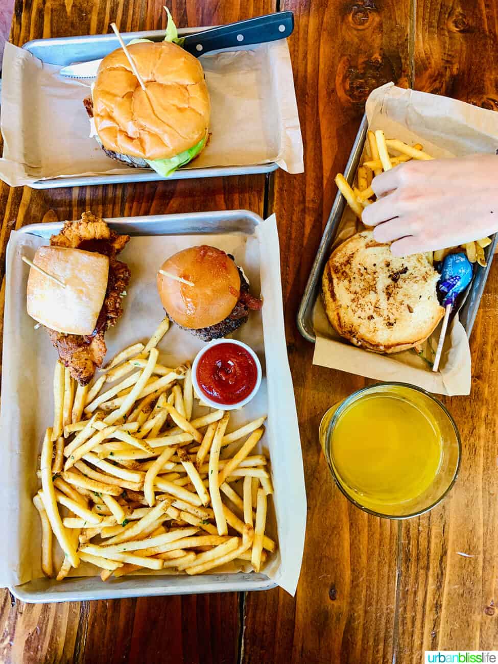 trays of burgers and fries.