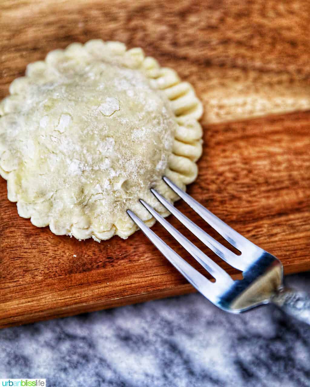 fork tines piercing hand pies to seal