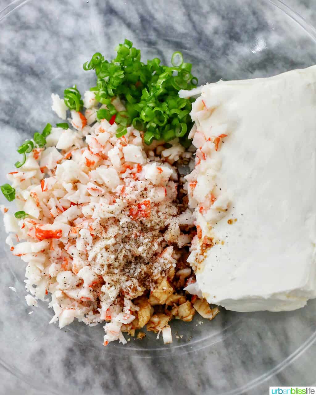 ingredients in bowl to make cream cheese filling for air fryer crab rangoon