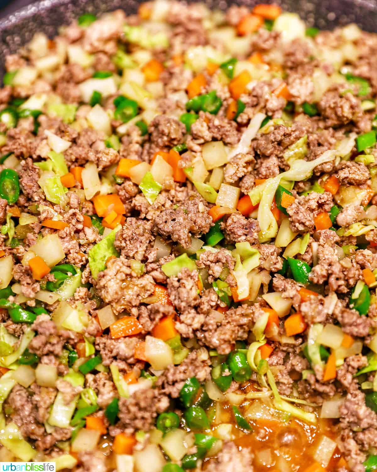 cooking the meat and vegetables for Filipino lumpia