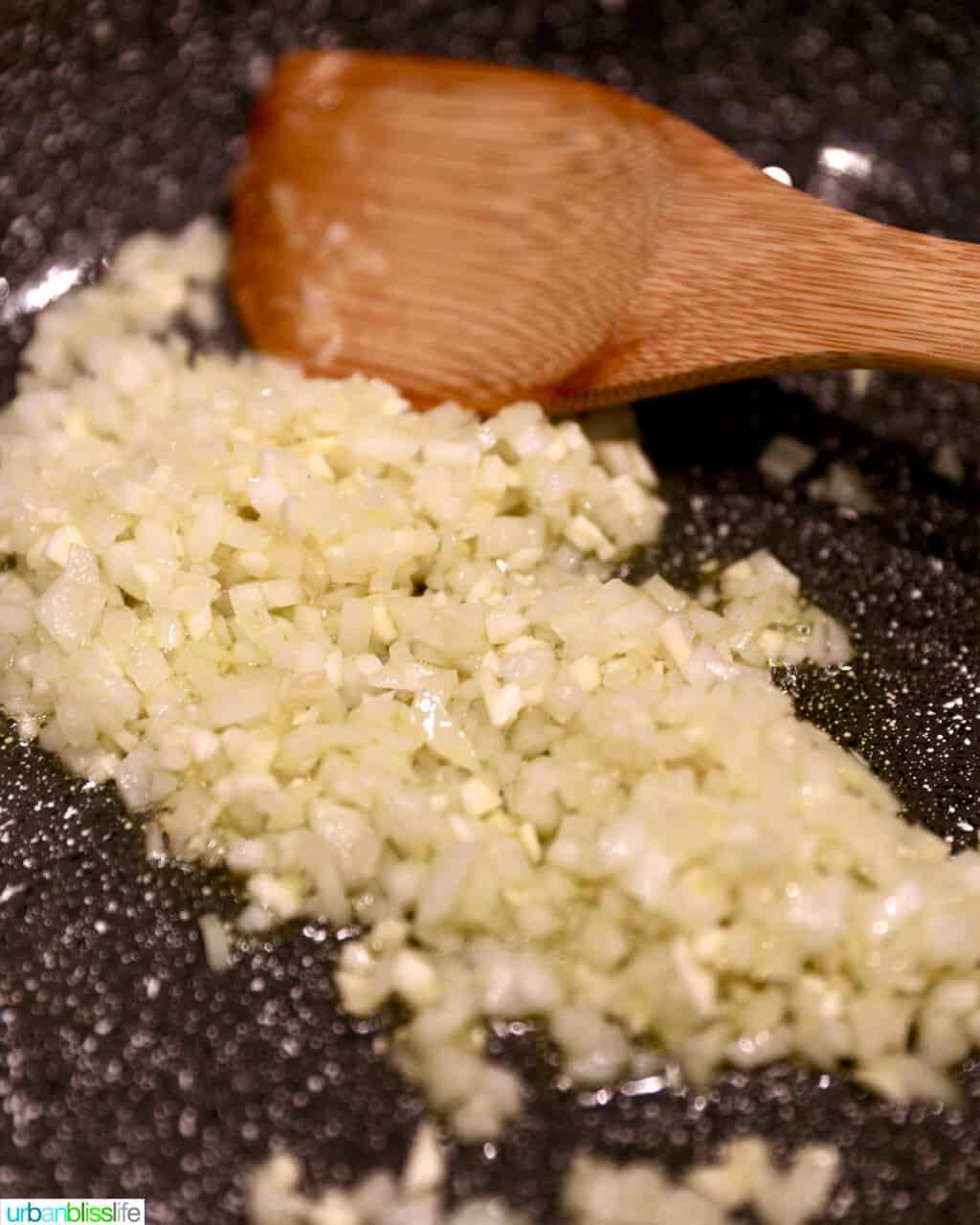 sauteing garlic and onions to make lumpia