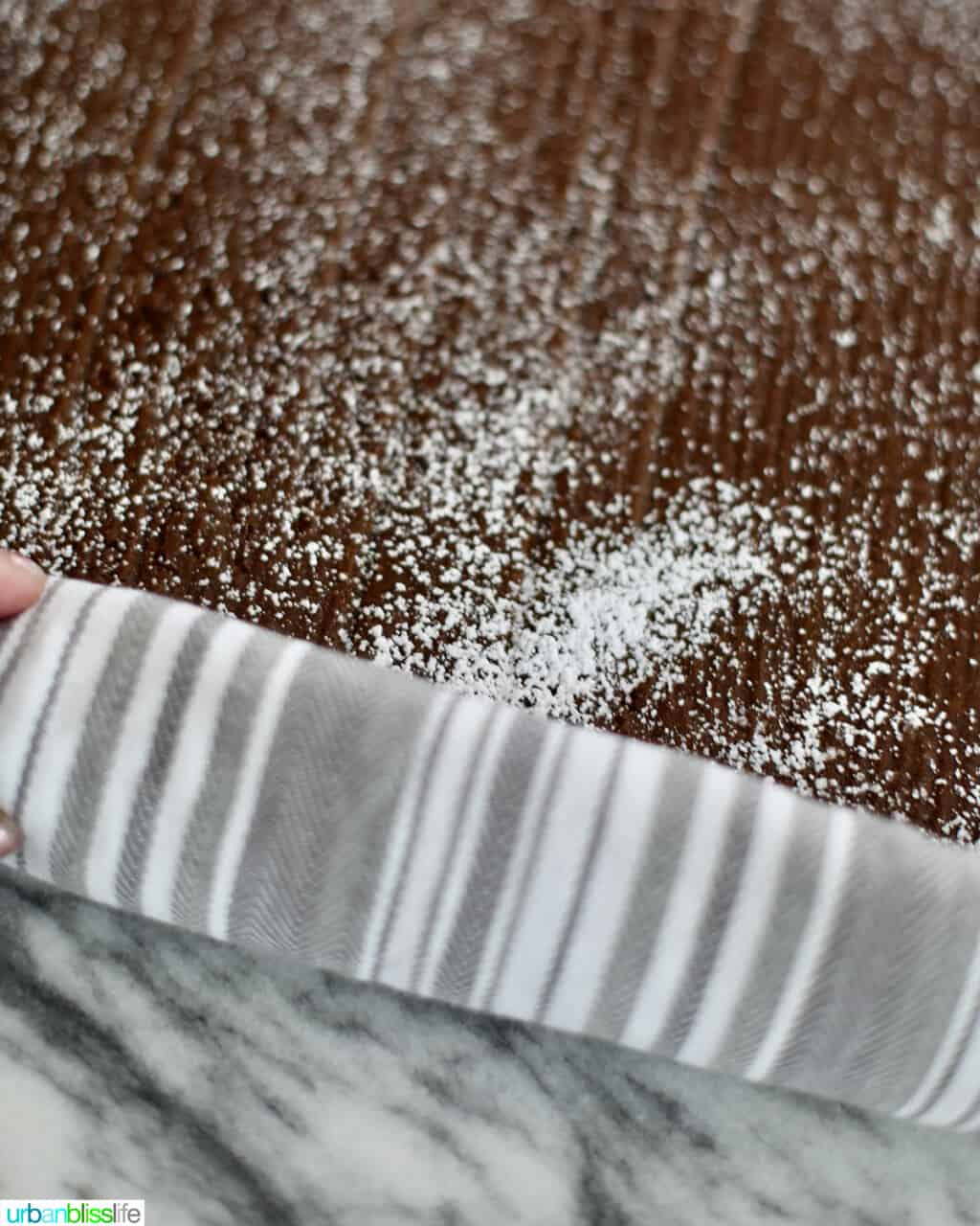 rolling up gingerbread cake roll layer