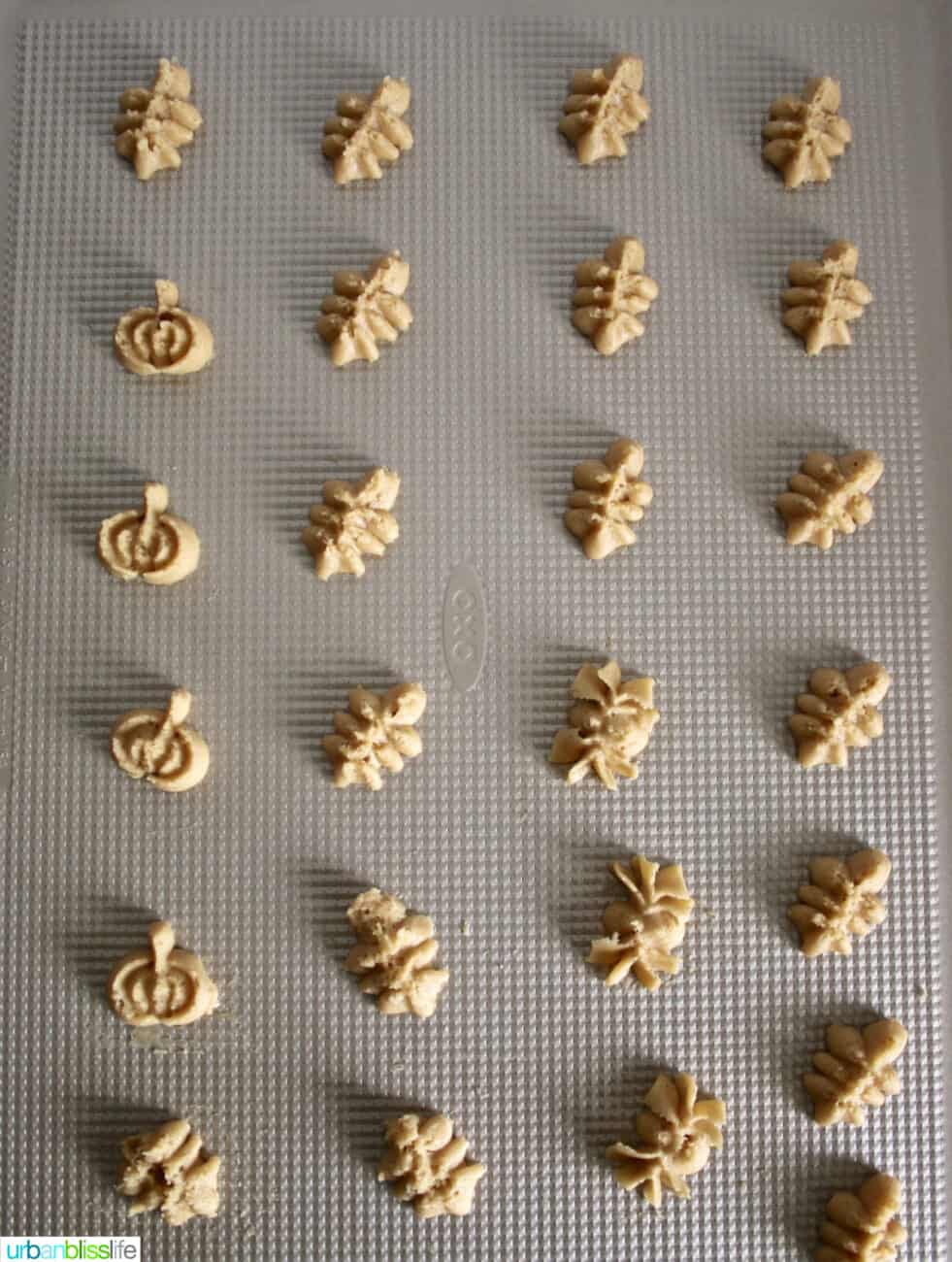 Spritz Cookie dough on a baking sheet