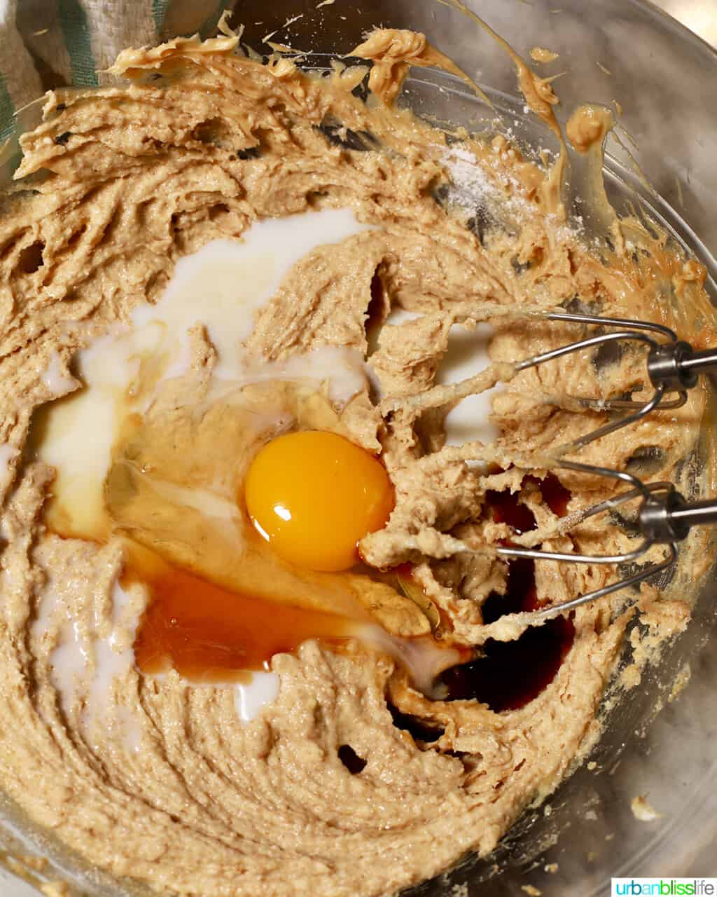 adding egg, milk, vanilla to cookie batter