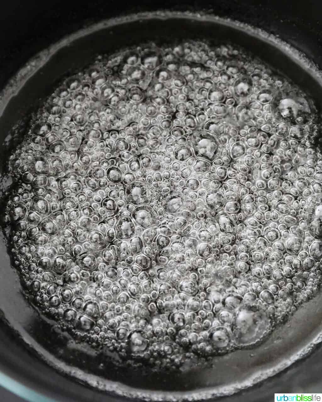 sugar bubbling in pot to make caramel