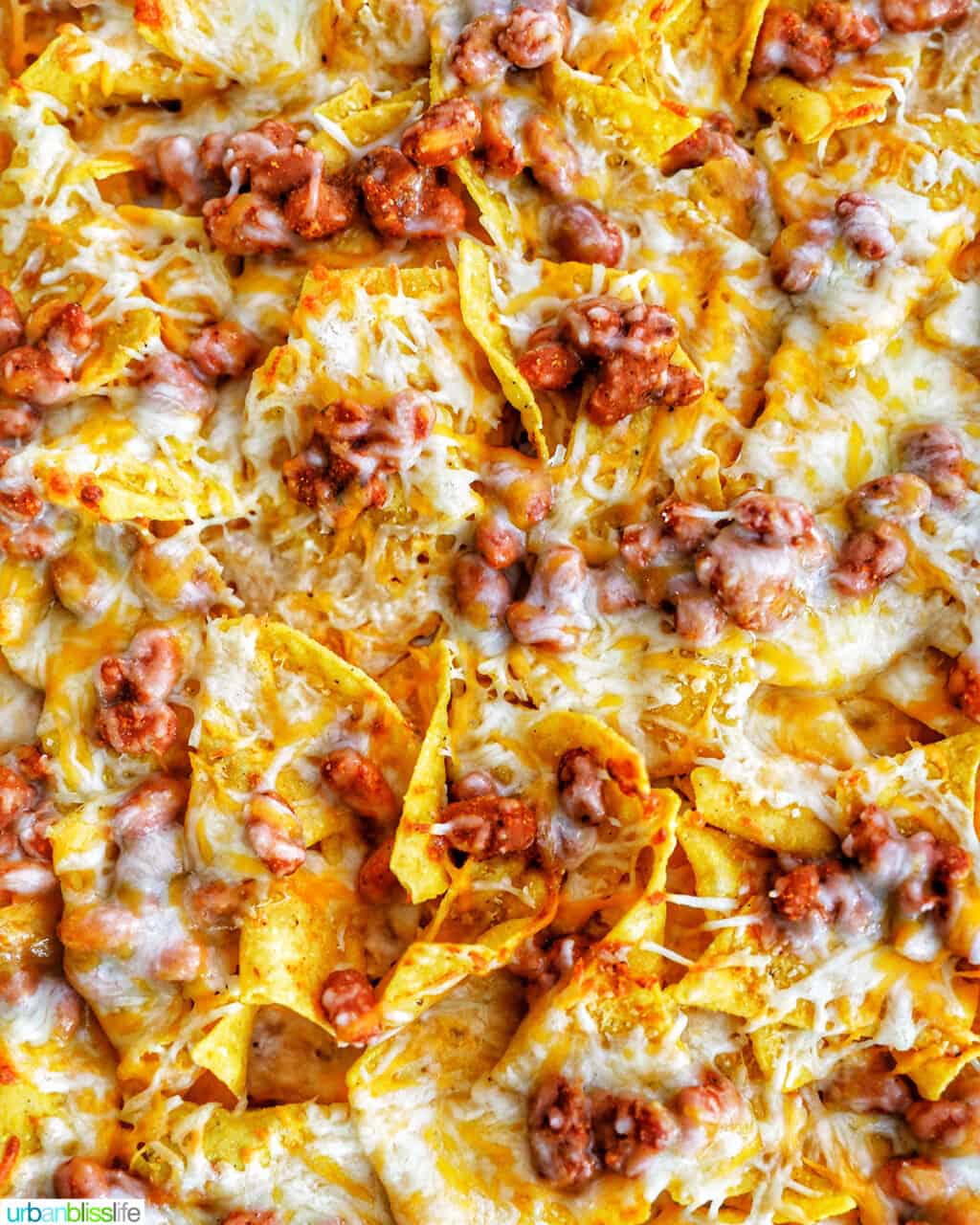 closeup of baked sheet pan vegetarian nachos without toppings