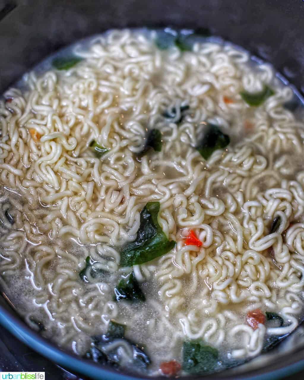 cooking ramen and udon noodles to make ram-don (Jjapaguri noodles)