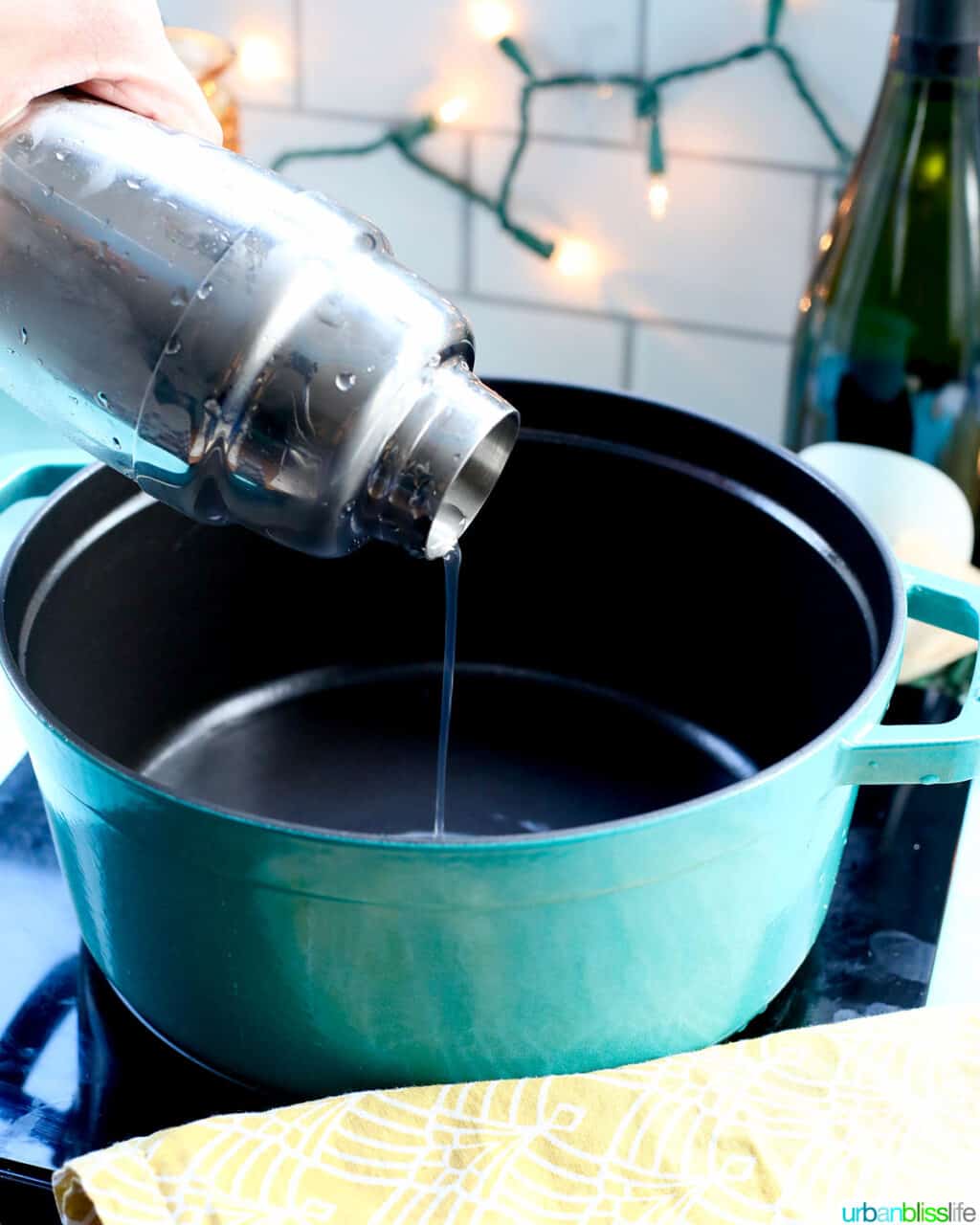 pouring shaker to make Champagne Jello Shots
