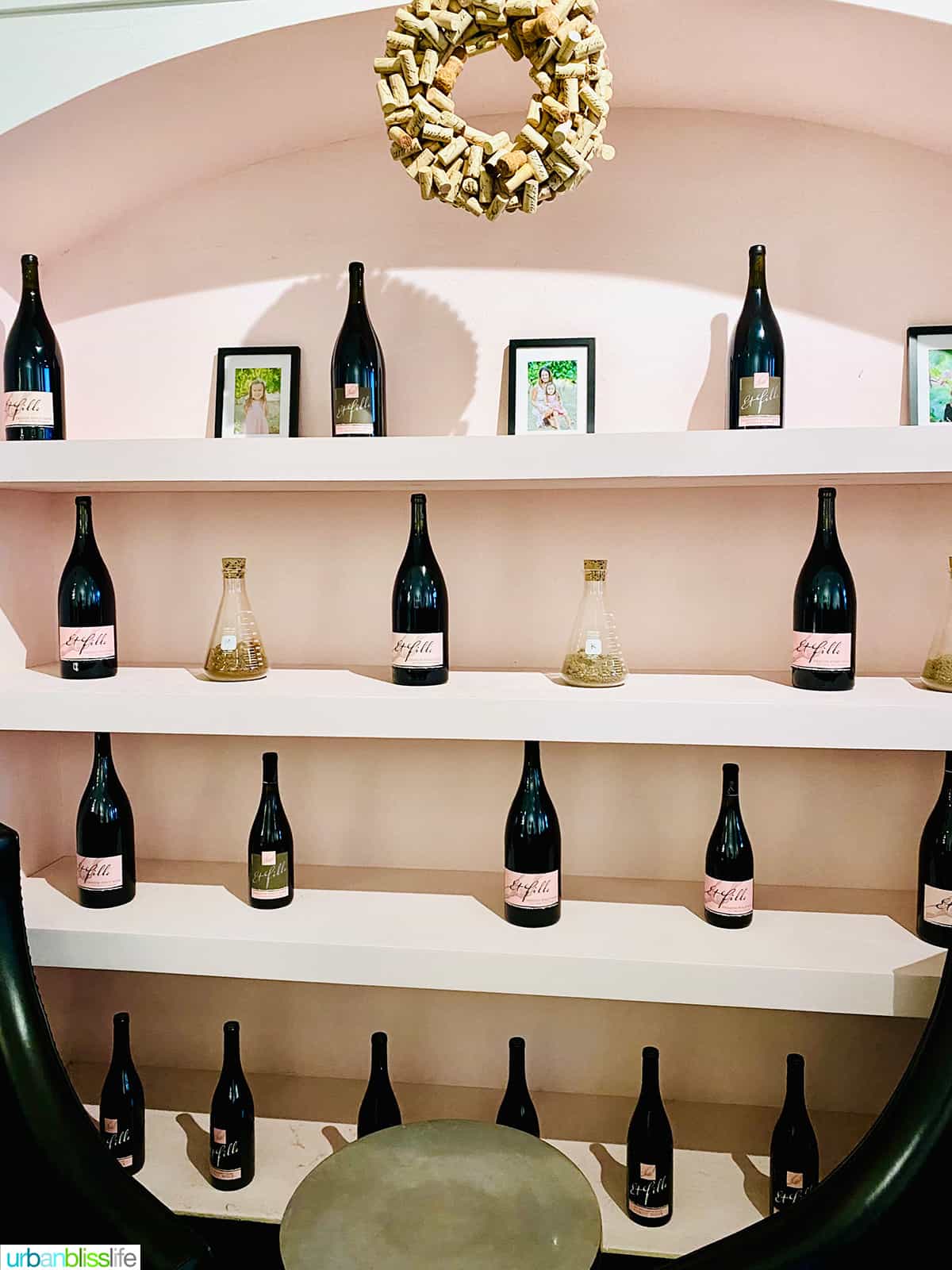 bottles on shelves at Et Fille tasting room in Newberg, Oregon.