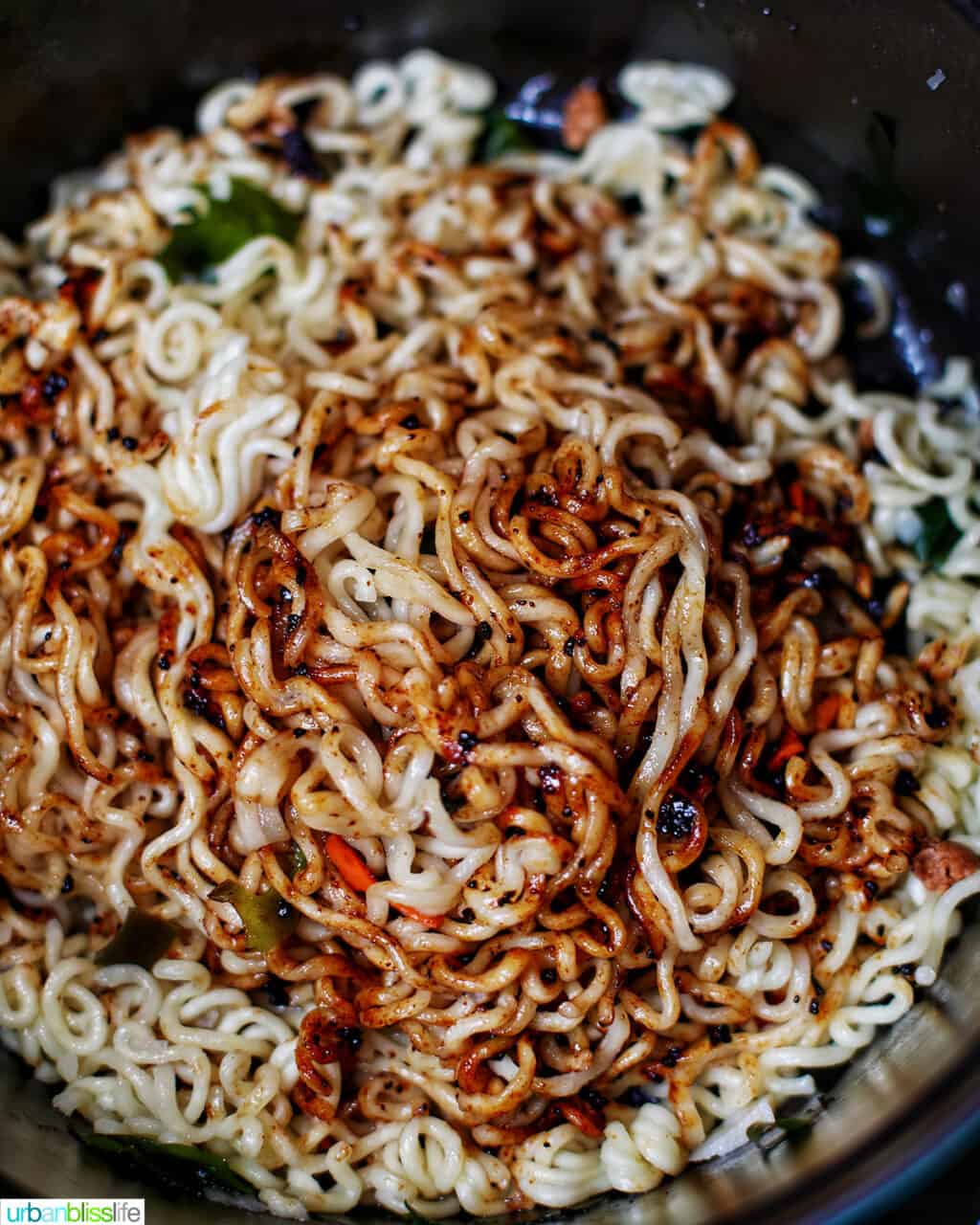 adding seasoning to ramen and udon noodles to make ram-don (Jjapaguri noodles)